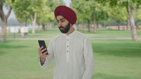 Angry-Sikh-Indian-man-shouting-on-video-call-in-park