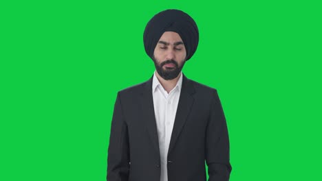 Un-Serio-Hombre-De-Negocios-Indio-Sikh-Protagonizado-Por-Una-Pantalla-Verde