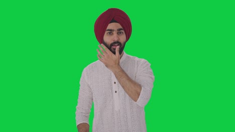 Happy-Sikh-Indian-man-getting-ready-to-go-out-Green-screen