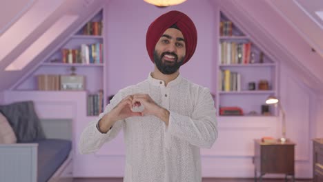 Happy-Sikh-Indian-man-showing-heart-sign