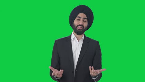 Glücklicher-Indischer-Sikh-Geschäftsmann,-Der-Mit-Jemandem-Auf-Grünem-Bildschirm-Spricht