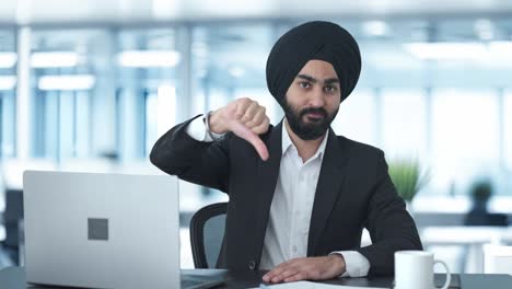 Disappointed-Sikh-Indian-businessman-showing-thumbs-down