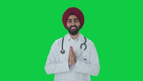 Glücklicher-Sikh-indischer-Arzt,-Der-Namaste-Green-Screen-Macht