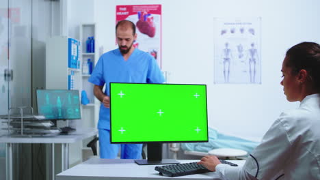 Assistant-giving-doctor-x-ray-image
