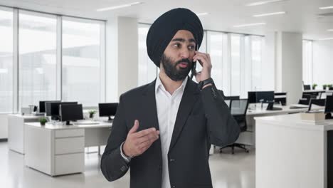 Angry-Sikh-Indian-businessman-shouting-on-call