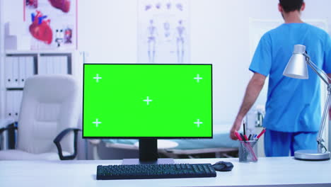 Dolly-shot-of-computer-with-green-screen