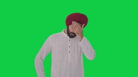 Hombre-Indio-Sikh-Enfermo-Que-Sufre-De-Dolor-De-Cabeza-Pantalla-Verde