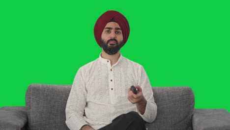 Frustrierter-Sikh-Indianer,-Der-Fernsieht,-Grünen-Bildschirm