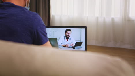 Man-having-an-online-consultation-with-his-doctor