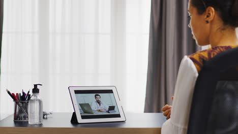 Female-patient-in-a-video-call-with-her-doctor