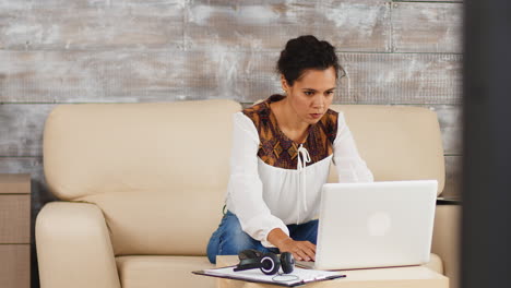 Smart-woman-working-on-laptop