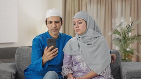 Angry-Muslim-couple-talking-their-child-on-video-call