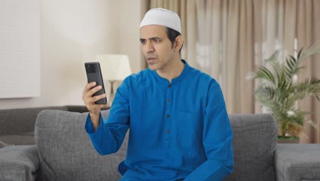 Angry-Muslim-man-talking-on-video-call