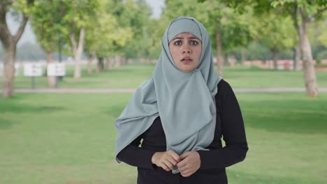 Muslim-woman-getting-a-shocking-news-in-park