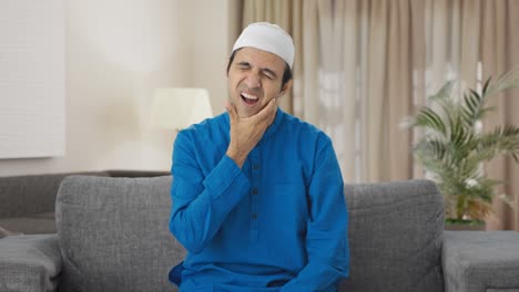 Sick-Muslim-man-suffering-tooth-pain