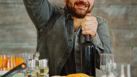Close-up-shot-of-man-opening-a-bottle-of-red-wine
