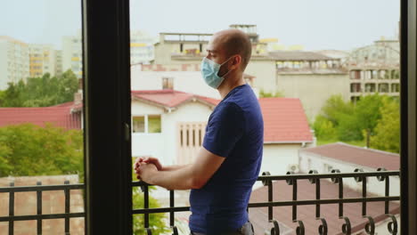 Man-during-self-isolation-sitting-on-the-balcony