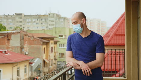 Anxious-man-with-mask-on-terrace