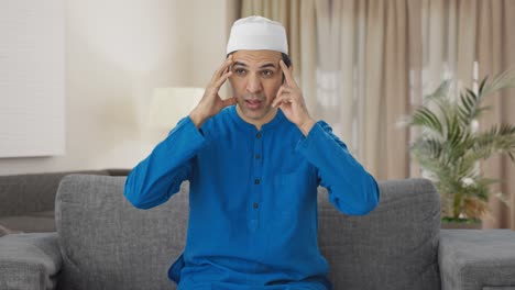 Kranker-Muslimischer-Mann-Leidet-Unter-Kopfschmerzen