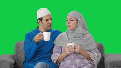Muslim-couple-drinking-tea-at-home-Green-screen