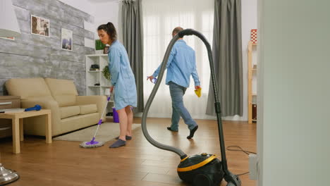 Man-wiping-dust-of-the-furniture