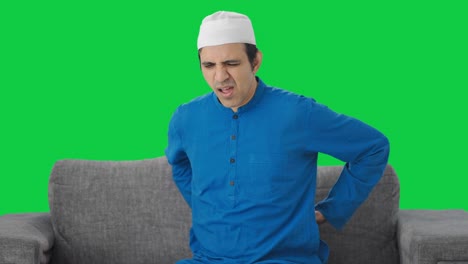 Sick-Muslim-man-suffering-back-pain-Green-screen