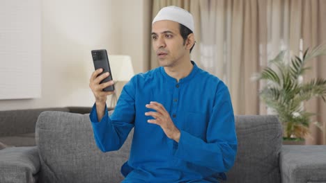 Muslim-man-talking-on-video-call