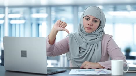 Disappointed-Muslim-businesswoman-thumbs-down