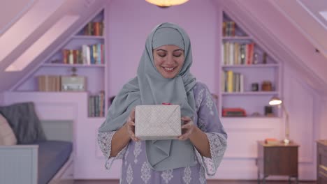 Happy-Muslim-woman-receiving-a-gift