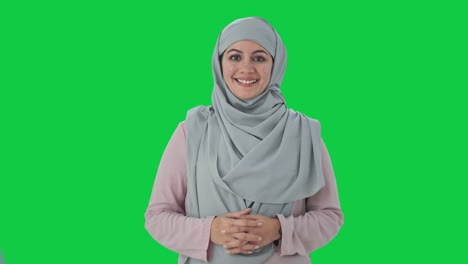 Muslim-businesswoman-smiling-to-the-camera-Green-screen