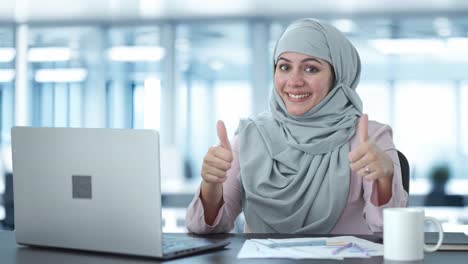 Happy-Muslim-businesswoman-thumbs-up