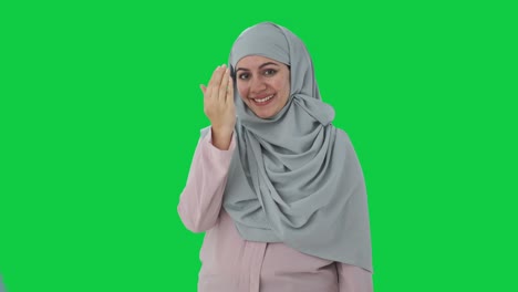 Happy-Muslim-businesswoman-doing-Adaab-Green-screen
