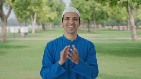 Happy-Muslim-man-saying-clapping-and-appreciating-in-park
