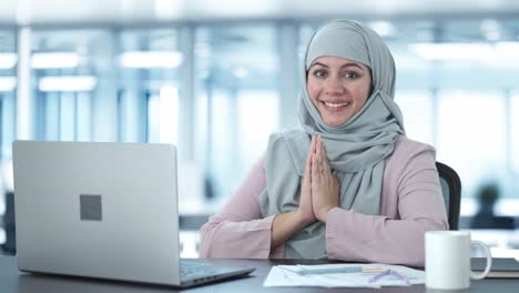 Happy-Muslim-businesswoman-doing-Namaste