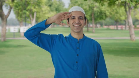 Happy-Muslim-man-saluting-on-camera-in-park