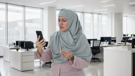 Angry-Muslim-businesswoman-talking-on-video-call