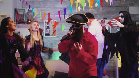 Bearded-pirate-singing-karaoke-at-halloween-party