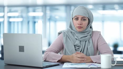 Muslim-businesswoman-talking-to-camera