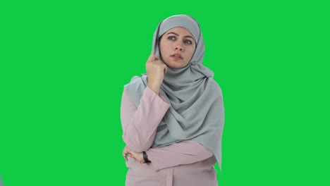 Confused-Muslim-businesswoman-thinking-something-Green-screen