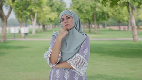 Confused-Muslim-woman-thinking-something-in-park