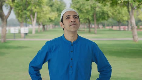Confused-Muslim-man-thinking-about-something-in-park
