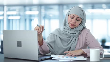 Sleepy-Muslim-employee-sleeping-in-office