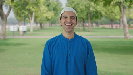 Happy-Muslim-man-laughing-on-someone-in-park