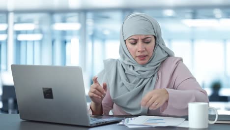 Angry-Muslim-businesswoman-doing-online-meeting