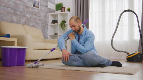 Tired-man-sitting-on-cozy-carpet