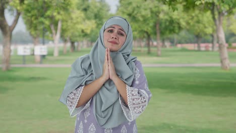 Guilty-Muslim-woman-saying-sorry-and-apologizing-in-park