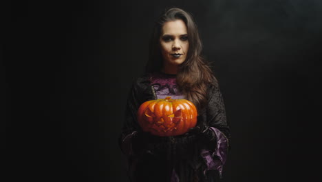 Beautiful-young-woman-with-evil-face-dressed-up-like-a-witch
