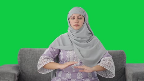Happy-Muslim-woman-doing-Yoga-Green-screen