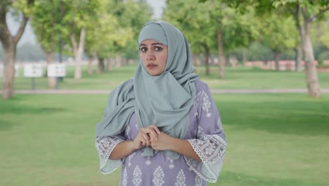 Sacred-and-afraid-Muslim-woman-in-park