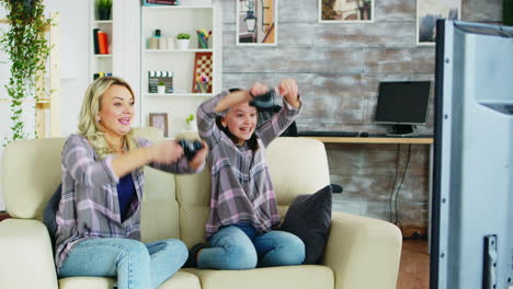 Beautiful-young-mother-playing-video-games-with-her-daughter